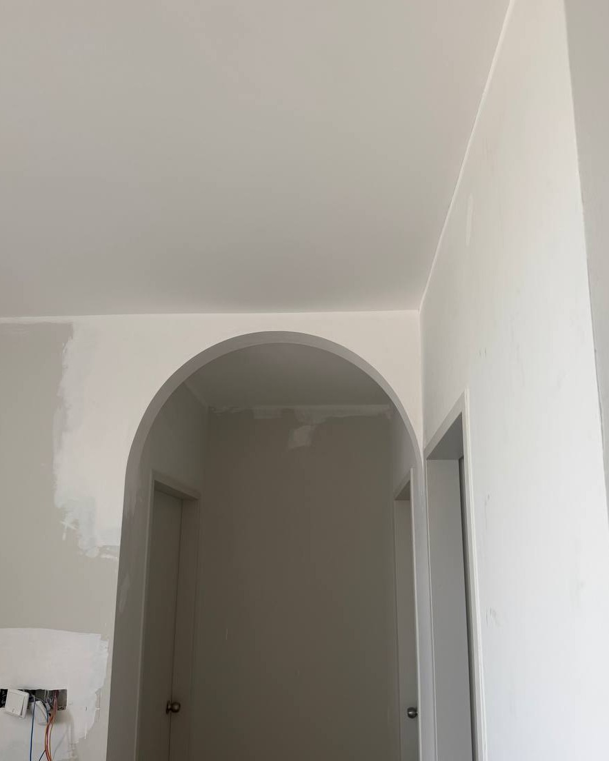 Curved Archway Doorway – Bangsar Ceiling Project Curved plaster archway leading to hallway with smooth flat ceiling finish, Bangsar residential ceiling design project