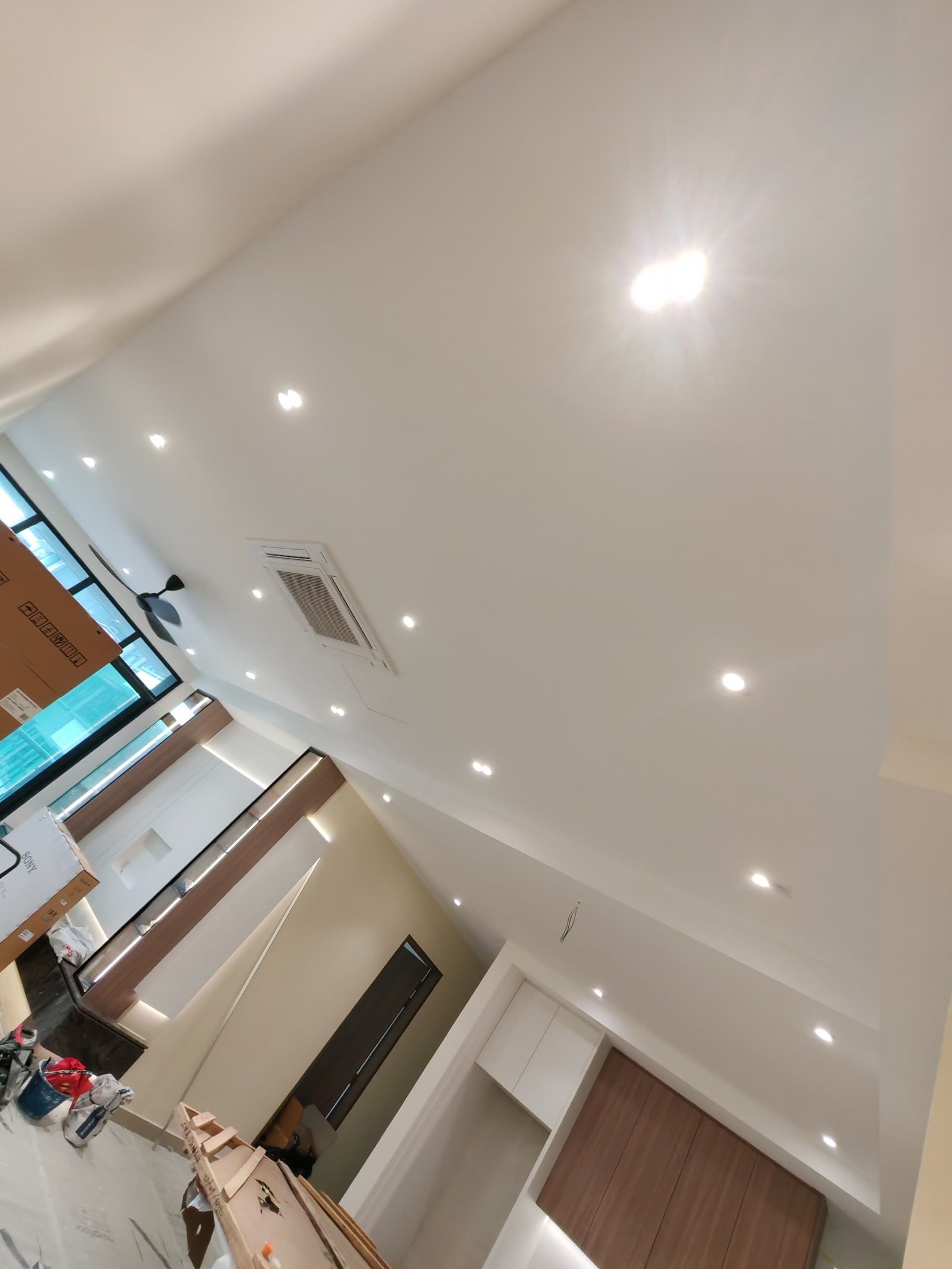 Downlight Plaster Ceiling – Sungai Long Living Area Plaster ceiling with recessed downlights, ceiling fan mounting point and aircon cassette unit in an open-plan living and dining area, Sungai Long renovation