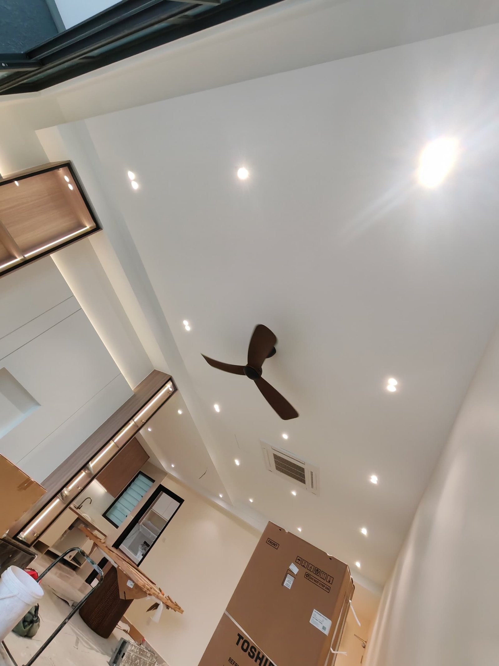 Ceiling and Fan Above Kitchen with LED-Lit Cabinetry Plaster ceiling with downlights and ceiling fan above kitchen area with under-cabinet LED strip lighting, Sungai Long renovation