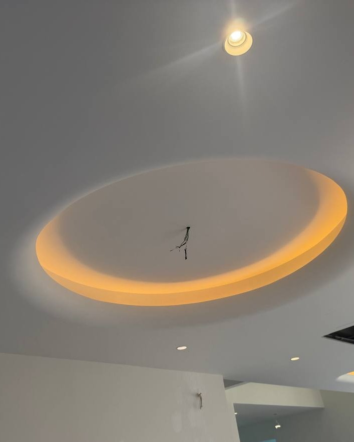 Oval Cove Lighting Plaster Ceiling – Klang Residence Oval recessed plaster ceiling cove with warm LED light trough and exposed pendant wiring, Klang residence circular light trough ceiling design