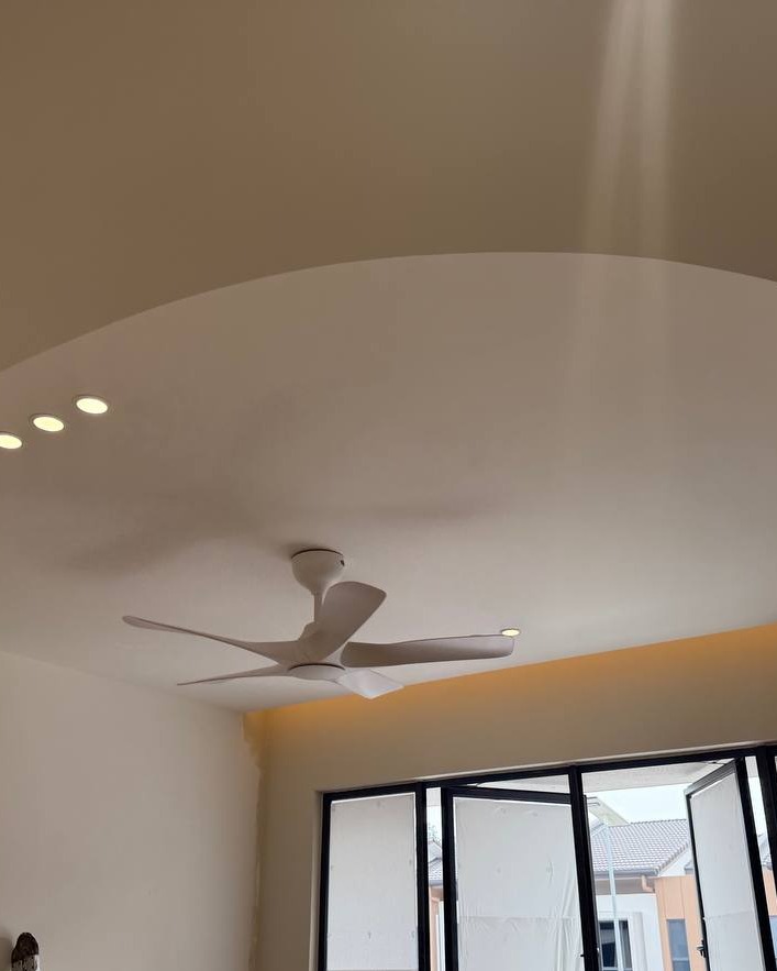 Curved Plaster Ceiling Design with Downlights - Rawang Curved plaster ceiling drop with recessed downlights and white ceiling fan installed in Rawang residential living room