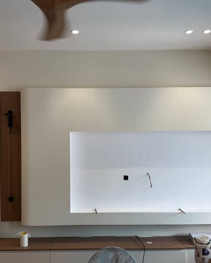 Curved Plaster TV Feature Wall with Cove Lighting - Rawang Curved plaster feature wall with recessed LED cove lighting above TV console area, plaster ceiling with downlights in Rawang residential ground floor renovation