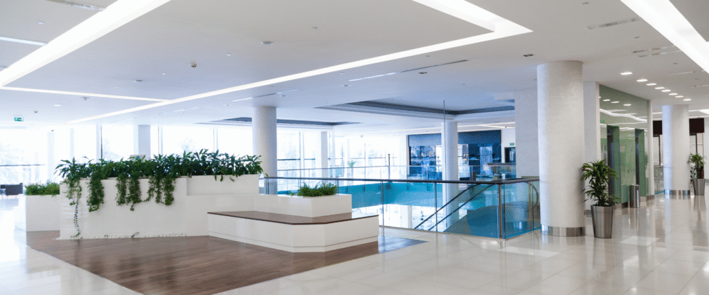 Upgraded commercial lobby ceiling with recessed lighting and clean plaster finish