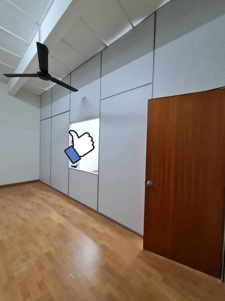 A completed room with dust-reducing acoustic partition walls and wooden door, offering a clean, modern, and quiet environment. Ideal for KL offices, studios, or classrooms.
