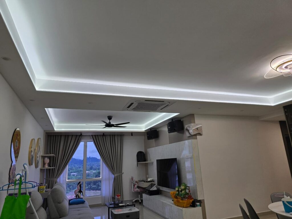 A sleek plaster ceiling design with hidden LED lighting for a contemporary living room interior in Kuala Lumpur. Tailored for comfort and visual elegance.