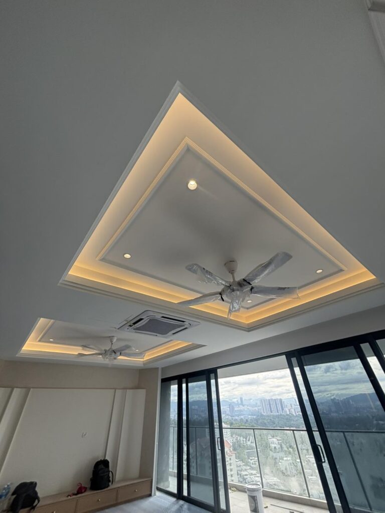 Elegant plaster ceiling upgrade with ambient LED cove lighting and integrated fan installation for a high-rise residence in Kuala Lumpur.