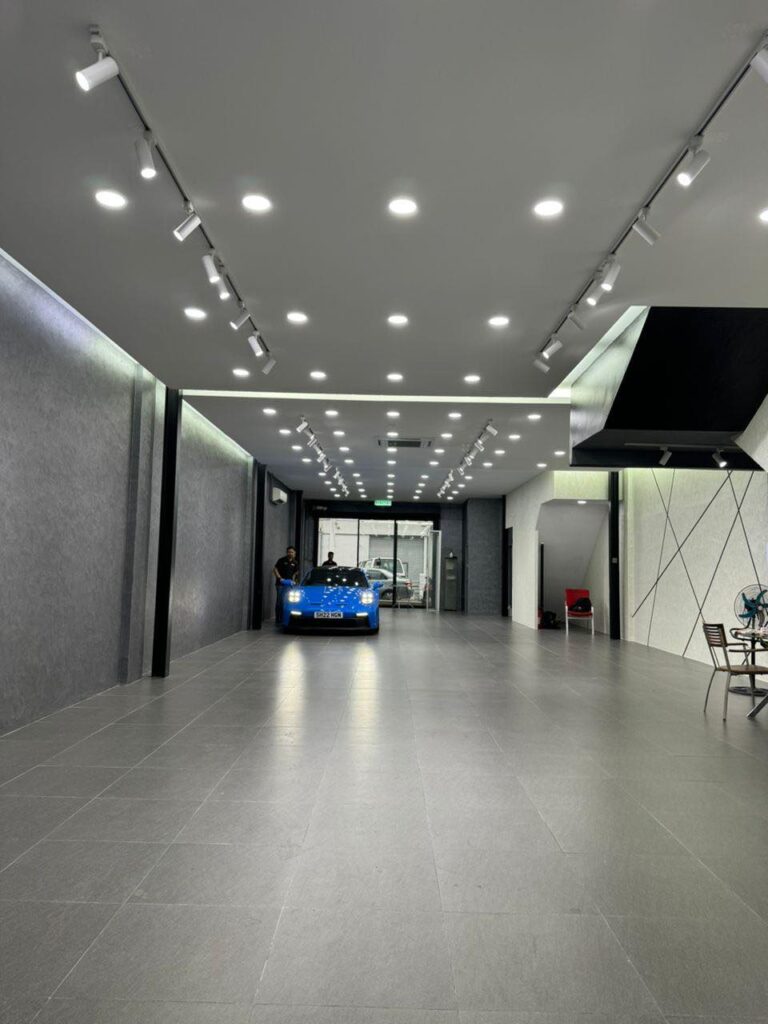 Completed plaster ceiling project with sleek lighting installation for a luxury car showroom in Kuala Lumpur.