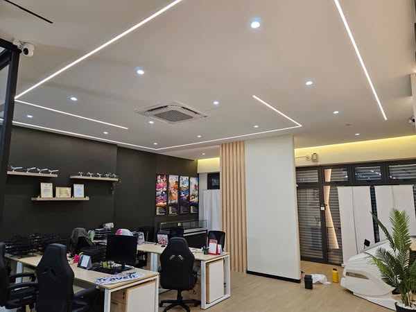 This wide-angle view showcases the completed Kepong commercial office featuring recessed lighting, clean partition walls, and ergonomic desk setups.