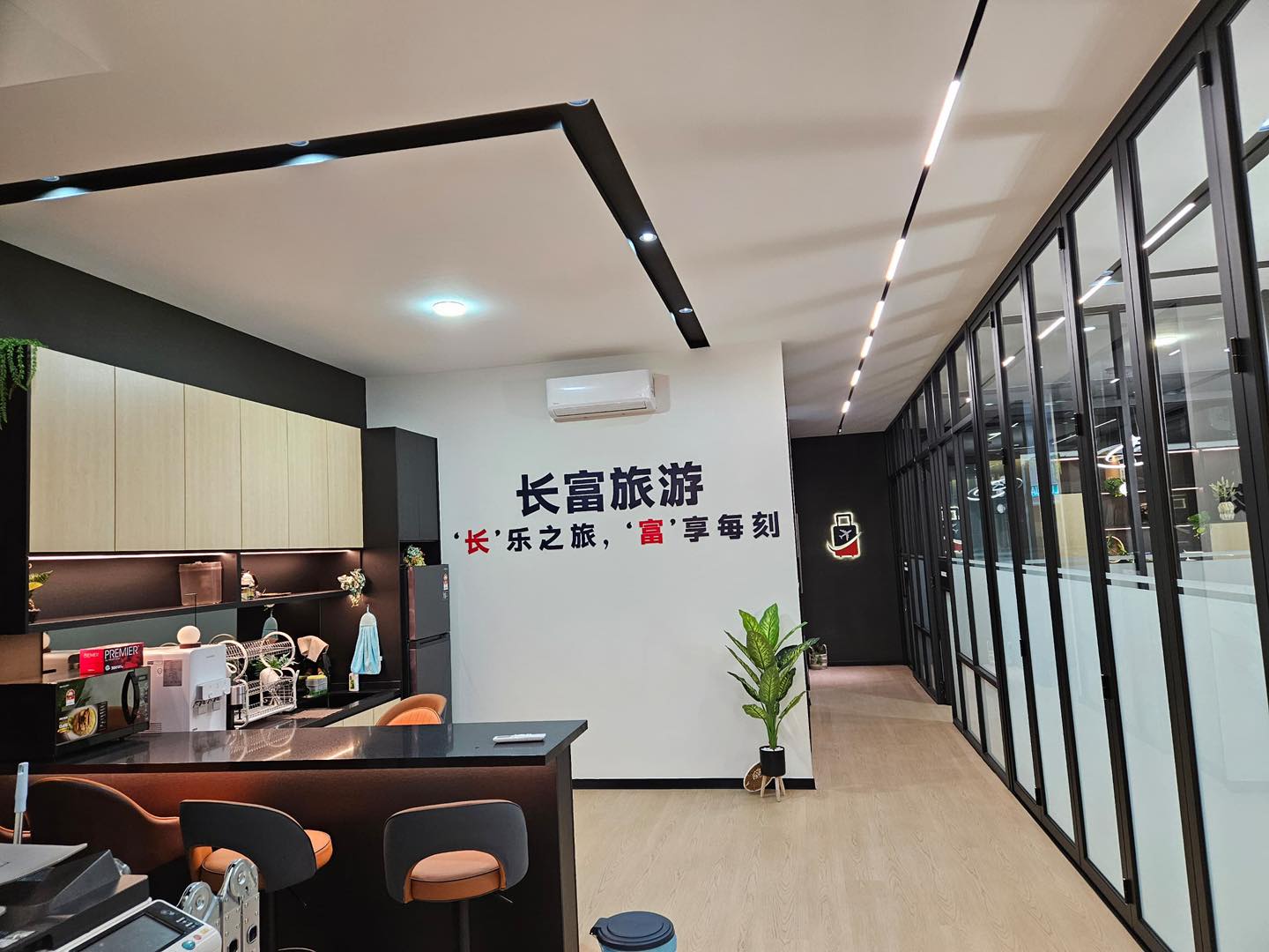 Kepong office ceiling renovation featuring integrated LED strip lighting and minimalist ceiling lines. A clean, modern setup perfect for enhancing workspace ambiance.