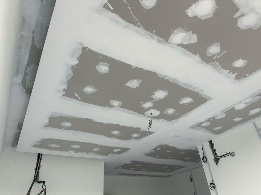 Plaster ceiling jointing in progress for a double-layer ceiling design at a Bukit Jalil residence. This stage prepares the ceiling for smooth finishing and modern lighting fixtures.