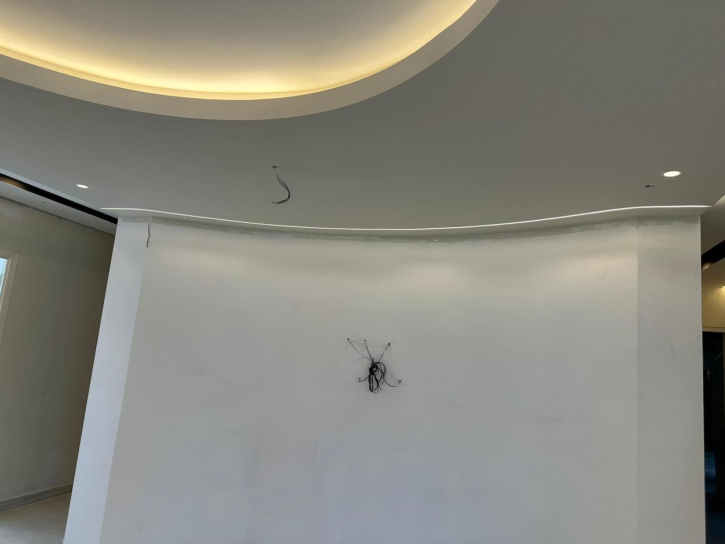 Work in progress: stylish curved ceiling with soft recessed LED lighting for modern interior design in KL.
