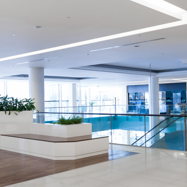 Upgraded commercial lobby ceiling with recessed lighting and clean plaster finish