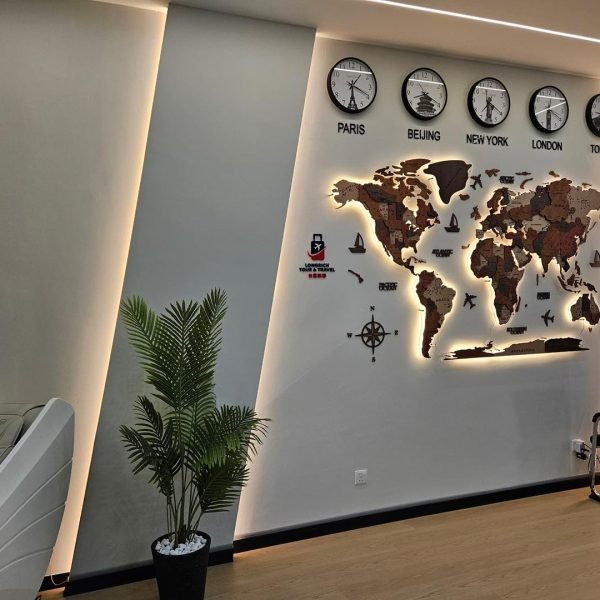 A striking world map feature wall enhanced with warm LED backlighting and recessed ceiling lights, part of our Kepong office ceiling and interior upgrade project.
