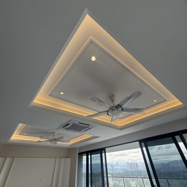 Elegant plaster ceiling upgrade with ambient LED cove lighting and integrated fan installation for a high-rise residence in Kuala Lumpur.