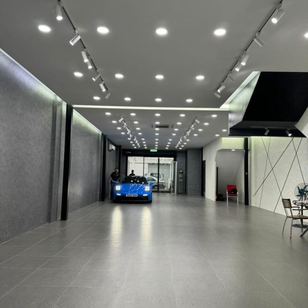Completed plaster ceiling project with sleek lighting installation for a luxury car showroom in Kuala Lumpur.
