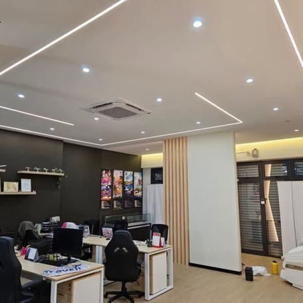 This wide-angle view showcases the completed Kepong commercial office featuring recessed lighting, clean partition walls, and ergonomic desk setups.