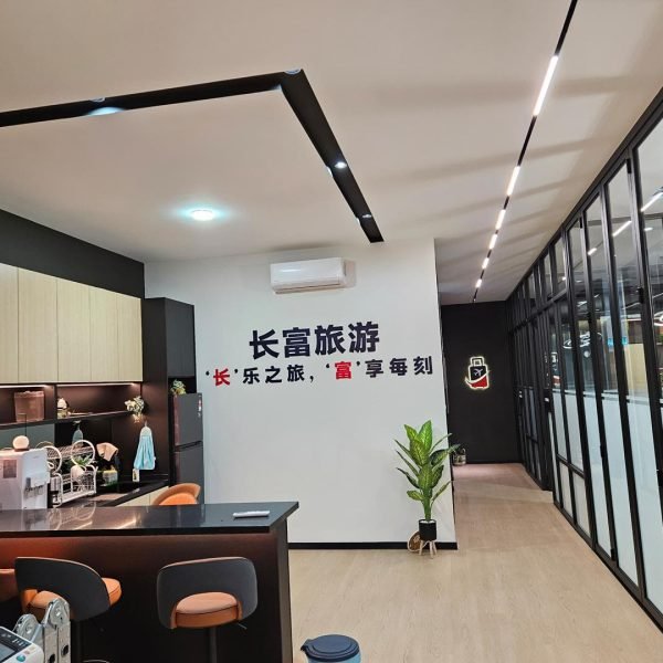 Kepong office ceiling renovation featuring integrated LED strip lighting and minimalist ceiling lines. A clean, modern setup perfect for enhancing workspace ambiance.