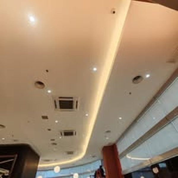 A sleek and layered plaster ceiling with cove lighting and ducted aircon layout—ideal for restaurants, meeting spaces, or modern office environments.

